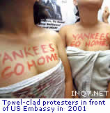Towel-clad protesters in front of US Embassy in 2001