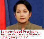 Somber-faced President Arroyo declares a State of Emergency on TV