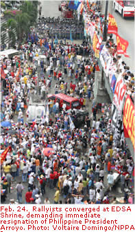 Feb. 24.  Rallyists converged at EDSA Shrine, demanding immediate resignation of Philippine President Arroyo. Photo: Voltaire Domingo/NPPA Images