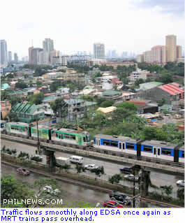 Traffic flows smoothly along EDSA once again as MRT trains pass overhead