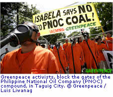 Greenpeace activists, block the gates of the Philippine National Oil Company (PNOC) 