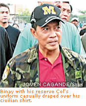 Binay with his reserve Col's uniform casually draped over his civilian shirt