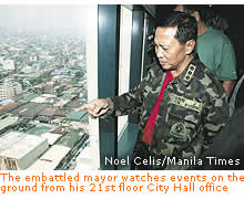 The embattled mayor Binay watches events on the ground from his 21st floor City Hall office