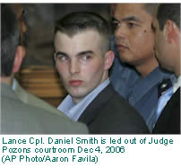 Lance Cpl. Daniel Smith is led out of Judge Pozons courtroom Dec 4, 2006.