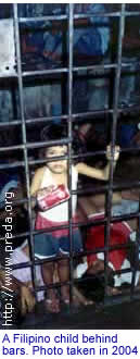 A Filipino child behind bars. Photo taken in 2004