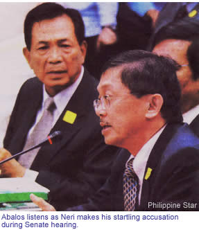 Abalos listens as Neri makes his startling accusation during Senate hearing
