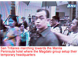 Sen Trillanes marching towards the Manila Peninsula hotel where the Magdalo group setup their temporary headquarters