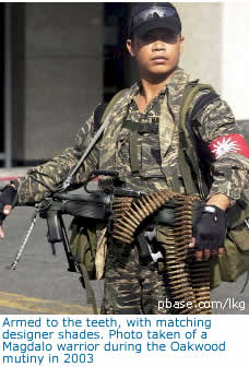 Armed to the teeth, with matching designer shades. Photo taken of a Magdalo warrior during the Oakwood mutiny in 2003
