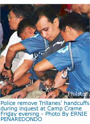 Police remove Trillanes' handcuffs during inquest at Camp Crame Friday evening - Photo By ERNIE PEAREDONDO 