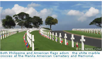 Both Philippine and American flags adorne the white marble crosses at the Manila American Cemetery and Memorial