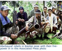 AbuSayyaf rebels in Basilan pose with their fire- power in in this Associated Press photo 