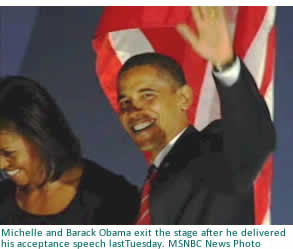 Michelle and Barack Obama exit the stage after he delivered his acceptance speech lastTuesday.