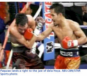 Paquiao lands a right to the jaw of dela Hoya.