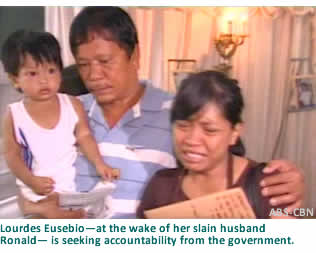 Lourdes Eusebio, at the wake of her slain husband Ronald,  is seeking accountability from the government
