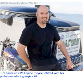 Tim Bauer on a Philippine tricycle refitted with his pollution-reducing engine kit