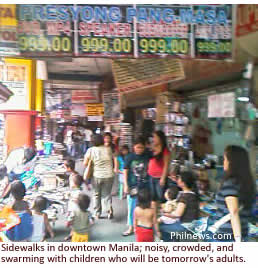 Sidewalks in downtown Manila; noisy, crowded, and swarming with children who will be tomorrow's adults