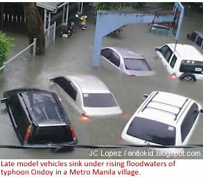 Late model vehicles sink under rising floodwaters of typhoon Ondoy (Ketsana) in a Metro Manila village