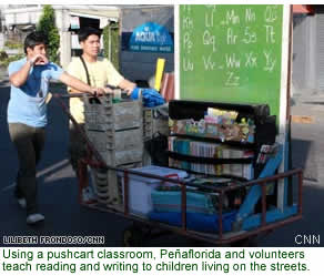 Using a pushcart classroom, Peaflorida and volunteers teach reading and writing to children living on the streets