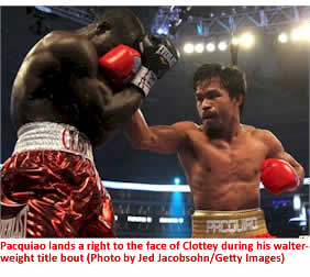 Pacquiao lands a right to the face of Clottey during his walter- weight title bout (Photo by Jed Jacobsohn/Getty Images)