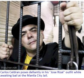 Carlos Celdran poses defiantly in his "Jose Rizal" outfit while awaiting bail at the Manila City Jail