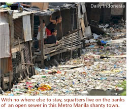 With no where else to stay, squatters live on the banks of  an open sewer in this Metro Manila shanty town
