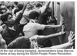 At the risk of being trampled, demonstrators keep Marcos tanks at bay during the EDSA People Power Revolution
