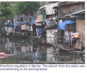 Riverfront squatters in Manila. The stench from the water was overwhelming to the photographer