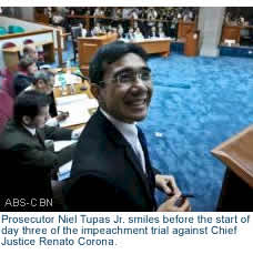 Prosecutor Niel Tupas Jr. smiles before the start of day three of the impeachment trial against Chief Justice Renato Corona