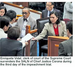 Enriqueta Vidal, clerk of court of the Supreme Court surrenders the SALN of Chief Justice Corona during the third day of the impeachment trial