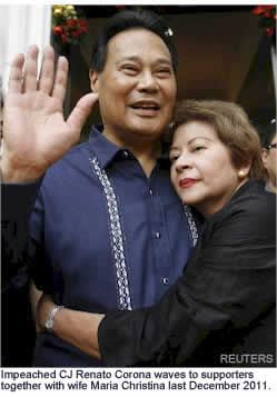 Impeached CJ Renato Corona waves to supporters together with  wife Maria Cristina last Dec. 2012