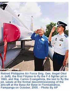 Retired Philippine Air Force Brig. Gen. Angel Okol Jr. (left), the first Filipino to fly the F-5 fighter jet in 1965, and Maj. Carlos Evangelista, the last to fly the jet, salute at the formal decommissioning of the aircraft at the Basa Air Base in Floridablanca, Pampanga on October, 2005. - Photo By AP