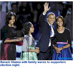 Barack Obama with family waves to supporters election night