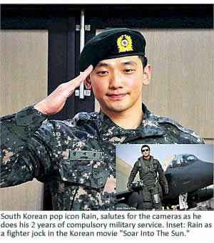 South Korean pop icon Rain, salutes for the cameras as he does his 2 years of compulsory military service. Inset: Rain as a fighter jock in the Korean movie "Soar Into The Sun" 