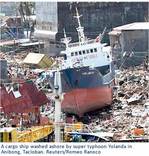 A cargo ship washed ashore by super typhoon Yolanda in Anibong, Tacloban. Reuters/Romeo Ranoco