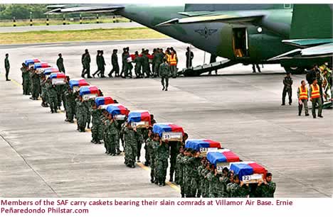 Members of the SAF carry caskets bearing their slain comrads at Villamor Air Base. Ernie Pearedondo Philstar.com