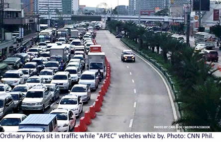 Ordinary Pinoys sit in traffic while "APEC" vehicles whiz by. Photo: CNN Phil.