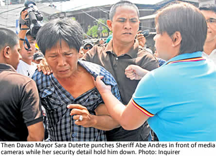 Then Davao Mayor Sara Duterte punches Sheriff Abe Andres in front of cameras while her security detail hold him down. Photo: Inquirer.net