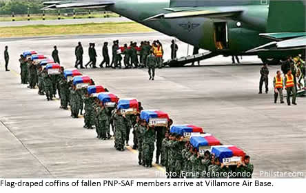 Flag-draped coffins of fallen PNP-SAF members arrive at Villamore Air Base