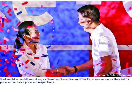 Red and blue confetti rain down during as Senators Grace Poe and Chiz Escudero announce their bid for president and vice president respectively