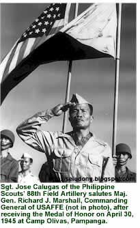 Sgt. Jose Calugas of the Philippine Scouts' 88th Field Artillery salutes Maj. Gen. Richard J. Marshall, Commanding General of USAFFE, after receiving the Medal of Honor on April 30, 1945 at Camp Olivas, Pampanga