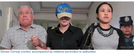Denise Cornejo (center) accompanied by relatives surrenders to authorities