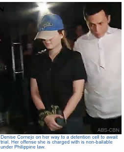 Denise Cornejo on her way to a detention cell to await trial. Her offense she is charged with is non-bailable under Philippine law